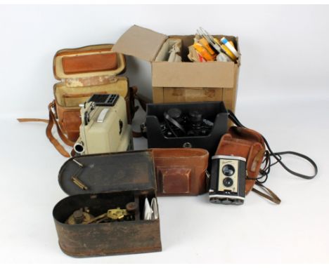 A Kodak Ltd of London 'Brownie' reflex camera, an Agifold example in leather case, a pair of Tasco 'Zip' 10 x 50mm binoculars