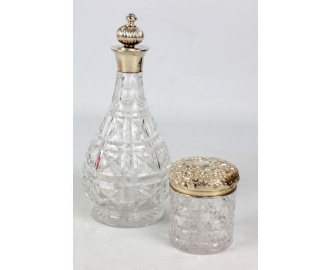 MAPPIN & WEBB; an Elizabeth II hallmarked silver collared clear cut glass decanter, Birmingham 1961, with associated stopper,