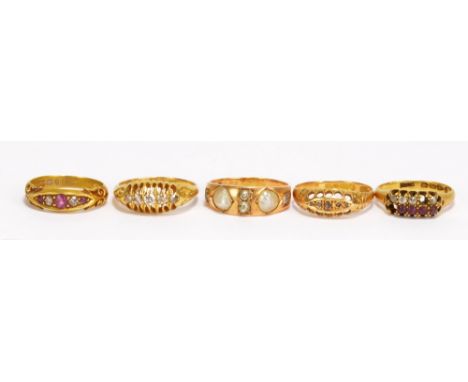 Five Victorian and Edwardian 18ct yellow gold dress rings to include a pearl and diamond example, 1892, a ruby and diamond ex