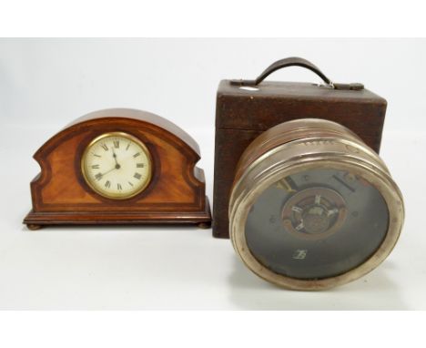 A cased pigeon racing timing clock, stamped to front 'RA 264' and the case stamped to exterior '59264', dial diameter 14.5cm,