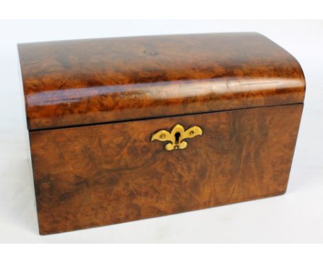 A Victorian figured walnut tea caddy with domed lid enclosing twin sectioned interior with lids, width 25.5cm, with key. COND
