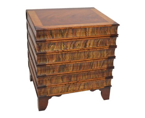 A modern box stool modelled as a stack of books, on four bracket feet, height 50.5cm, top 46 x 38cm. CONDITION REPORT: There 