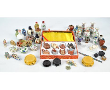A collection of various predominantly Chinese miniatures to include three Canton Export Famille Rose porcelain vases, height 
