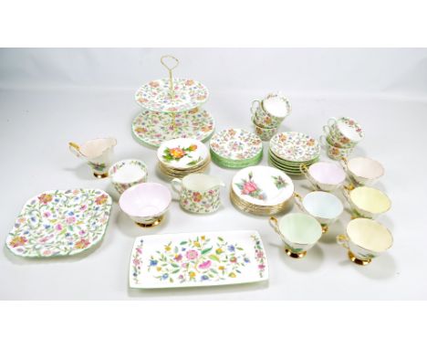 A Minton 'Haddon Hall' six setting tea set comprising trios, a two tier cake stand, a cake plate, sandwich plate, a cream jug