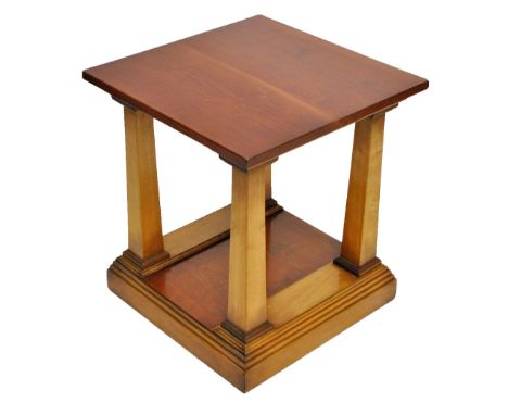 C KENNEDY OF IPSWICH; a contemporary square sectioned two tiered lamp table, the top 56cm squared, purchased from Harrods.