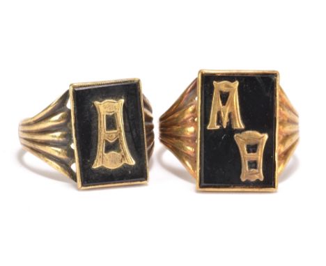 A pair of 9ct yellow gold gentleman's signet rings with rectangular black onyx platforms with applied initials, size R and U1