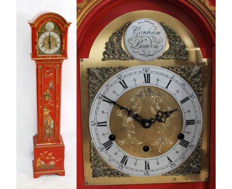 A reproduction red lacquered chinoiserie grandmother clock with arched dial and three chain movements, height 149cm.