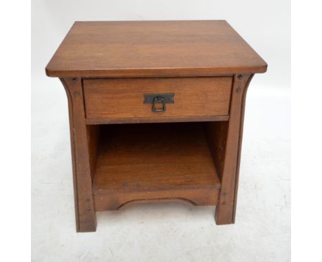 An Arts and Crafts style oak side table with single drawer above shelf, width 57cm, height 60cm.