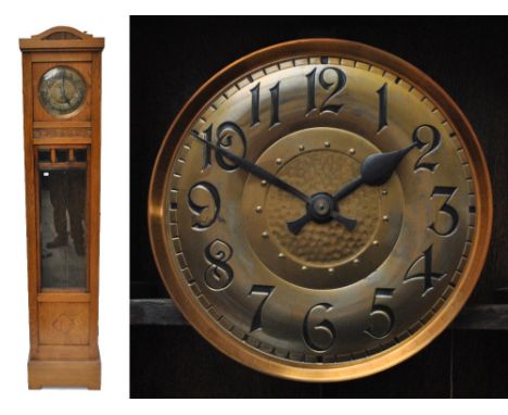 An early 20th century oak cased two weight chiming longcase clock, the brass dial set with Arabic numerals around central ham