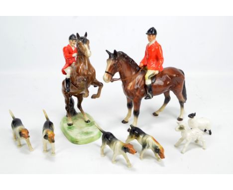 A collection of Beswick figures to form a hunting group comprising 'Huntsman (on rearing horse)', no.868, height 25cm, 'Hunts