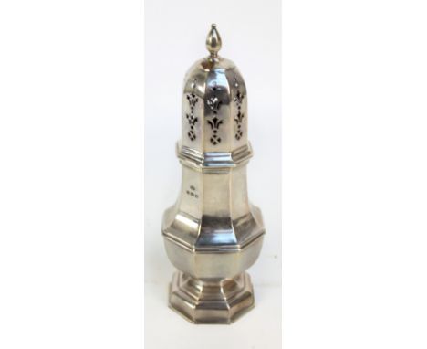ADIE BROS LTD; a large George V hallmarked silver footed sugar caster of octagonal baluster form with pierced domed lid and f