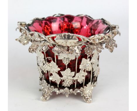 EDWARD & JOHN BARNARD; a Victorian hallmarked silver shaped circular open framework basket of flared form cast decorated with
