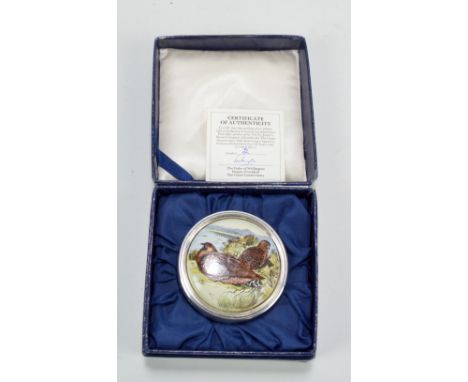 ST JAMES HOUSE CO; an Elizabeth II hallmarked silver limited edition circular pill box, set with enamel roundel to the detach