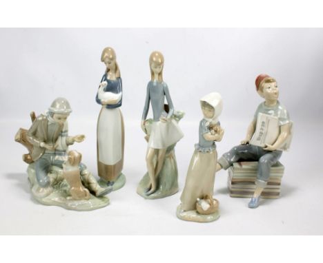 Five various Nao figures to include a boy playing with a dog, a newspaper seller boy and a girl holding a puppy (5).