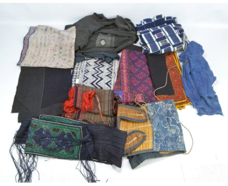 A quantity of Japanese textiles and garments including a blanket, haori, etc.