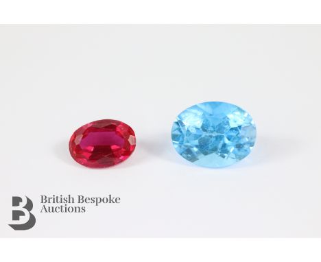 Loose gem stones - ruby 8 x 5 x 4mm and oval blue topaz 9 x 7 x 6mm.