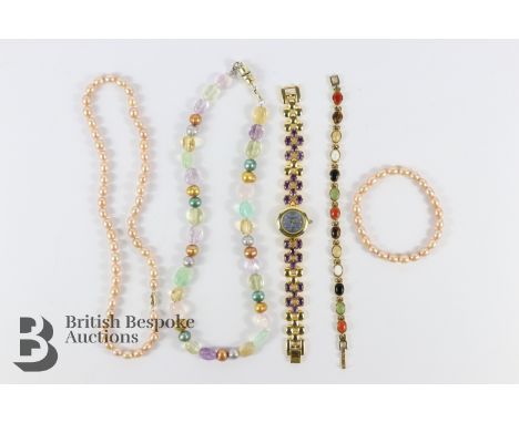Pink cultured pearl necklace and bracelet set on a 14k gold clasp; Marcel Drucker lady's wrist watch. The watch having a moth