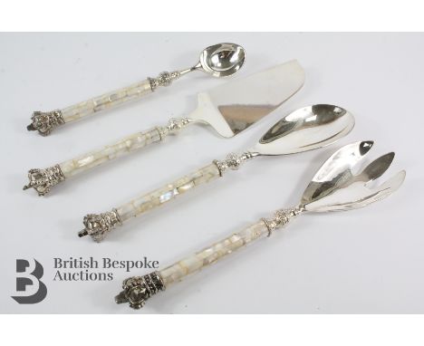 Set of mother of pearl salad servers, ice cream scoop and cake slice. Each piece terminating with a crown finial.&nbsp;