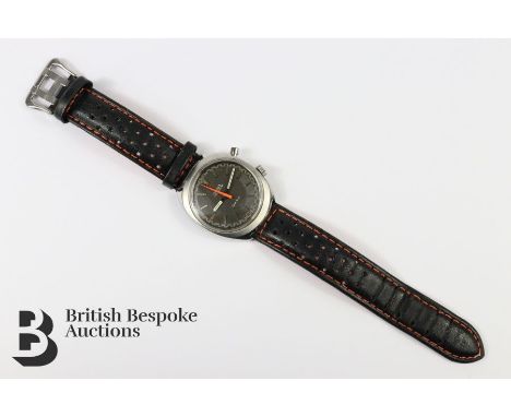 Omega Chronostop watch, the watch having a charcoal face with baton numerals and luminescent stop watch hand. Watch moving fo