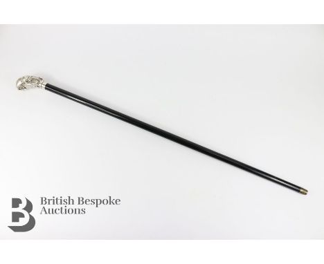 Ebony and silver-collared walking stick, Birmingham hallmark, dated 1993, mm having a white metal owl-form grip, approx 95 cm