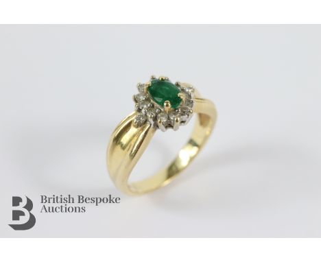 14ct yellow gold emerald and diamond ring. The ring set with approx 24 pts of brilliant-cut diamonds and an oval-cut emerald 