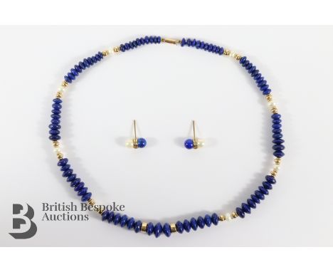 A Lapis Lazuli and pearl necklace, approx 39 cms, having a 9ct gold clasp together with a pair of matching earrings.&nbsp;