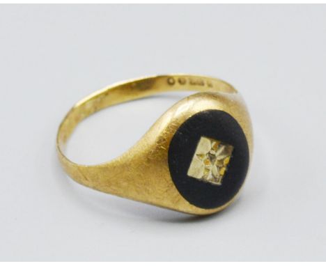 A 9ct Gold Signet Ring, set with a diamond, 2.9 grams, ring size U 