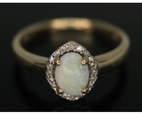 A precious opal and diamond cluster ring, marked 375, gross wt. 1.78g, size L.&nbsp;Condition - very good, general wear only.