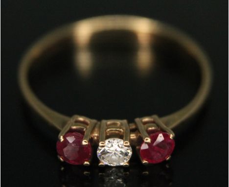 A ruby and diamond ring, 9ct gold import marks, gross wt. 1.09g, size K.  