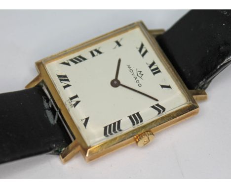 A 1960s hallmarked 9ct gold Movado wristwatch with signed white dial having Roman numerals and baton hands, the 25 x 32mm squ