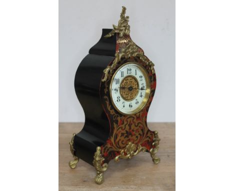 A French late 19th century boulle mantle clock, height 30cm.Condition: currently working however not sold with any guarantees
