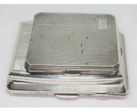 A group of three hallmarked silver cigarette cases, wt. 12 1/4oz.&nbsp;Condition - general wear including minor dings, scratc