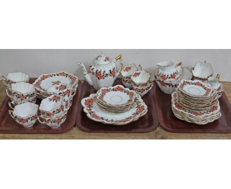 A 50 piece Wileman & Co tea service.Condition: Cracks and repairs to sugar bowl, age related wear to decoration and rubbing t