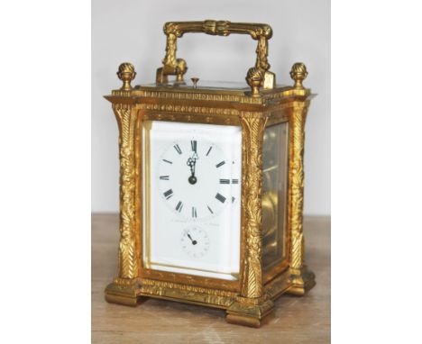 A French late 19th century gilt engraved and chased repeater carriage clock, the dial with Roman numerals, hour subsidiary an