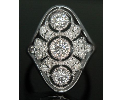 A diamond cluster ring, the central millegrain and bezel set modern round brilliant cut stone weighing approx. 0.30 carats, t