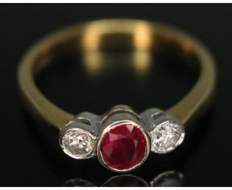 A bezel set ruby and diamond ring, hallmarked 18ct gold, gross wt. 3.24g, size N.&nbsp;Condition - minor wear to band and set