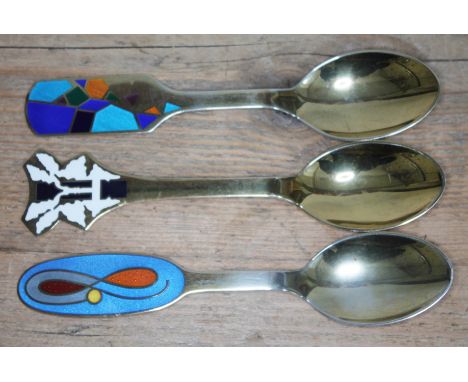 A set of three Danish silver gilt and enamel spoons, various designers for Michelsen, length 16cm each.  