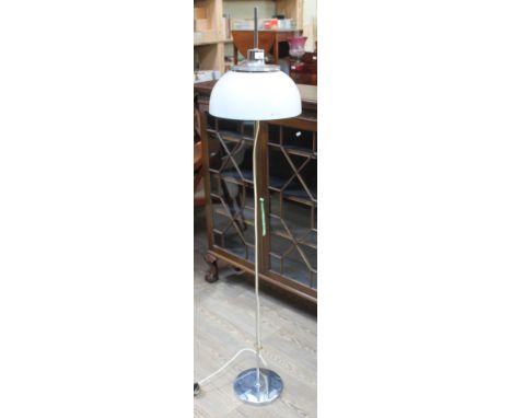 A mid 20th century retro Harvey Guzzini chrome floor standing lamp with adjustable white plastic mushroom shade over twin lam