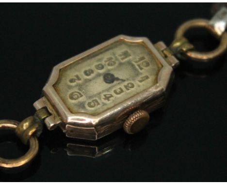 An early 20th century hallmarked 9ct gold ladies 15 jewel manual wind wristwatch, the outer of the case stamped 'B.W.C London