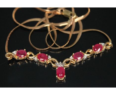 A 9ct gold ruby and diamond necklace, the cluster length 52mm, chain length 45cm, 9ct gold import marks, gross wt. 4.64g.  Co