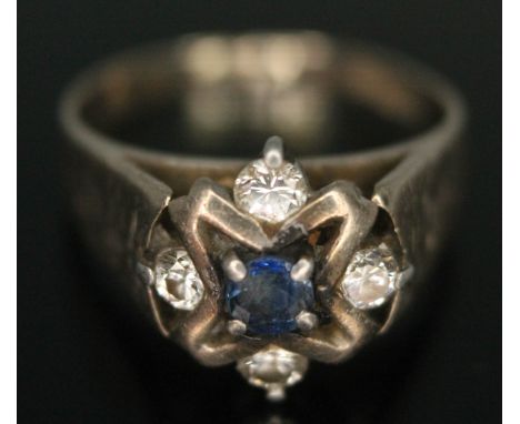 A diamond and sapphire cluster ring marked 18ct gold, band cut, gross wt. 4.35g, approx. size J/K.  