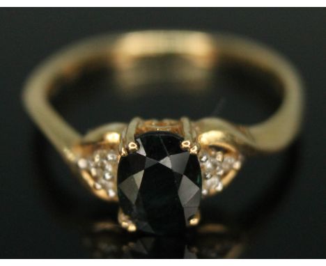 A hallmarked 18ct gold sapphire ring with diamond set shoulders, gross wt. 2.09g, size K.  