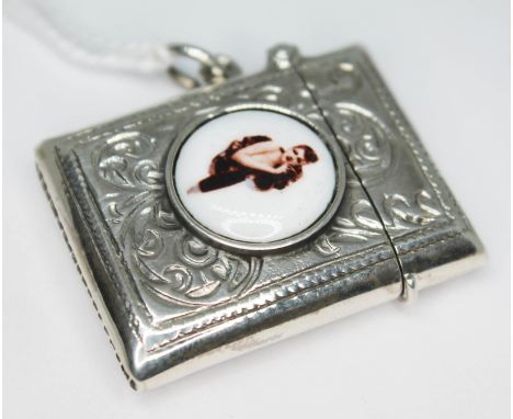 A vesta case with enamel cabochon depicting a semi nude lady, marked 925.