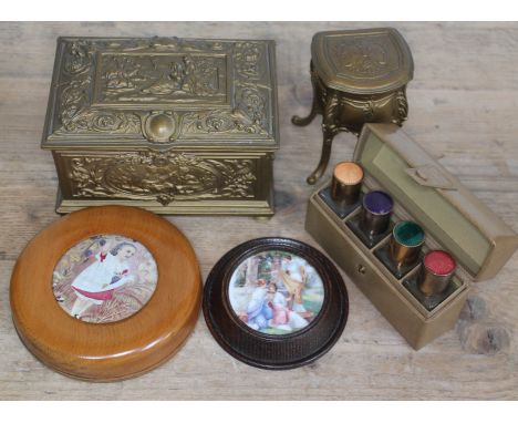 A mixed lot comprising a cased set of enamel topped bottles, two metal trinket boxes and two pot lids.  