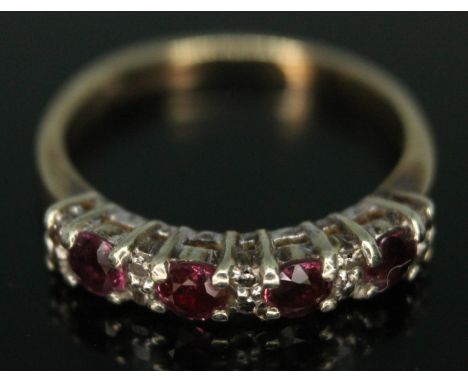 A diamond and ruby cluster ring, hallmarked 9ct gold band, gross wt. 1.90g, size J.&nbsp;Condition - very good, no damage/rep