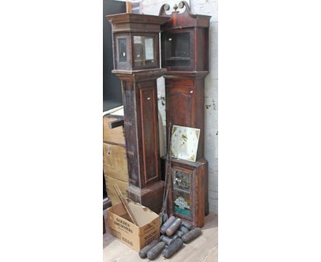 Assorted clock spares comprising two long case clock cases, a painted dial, an American wall clock, five pendulums and twenty