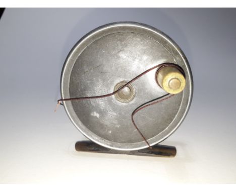 A 3" fly reel inscribed 'R Heaton Maker'. 