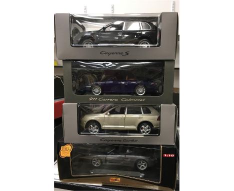 Four 1/18 scale Porsche models. Appear E-M and boxed. 