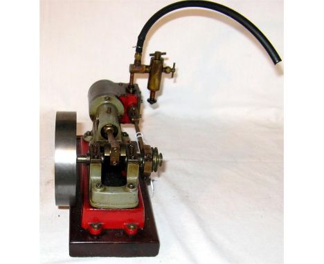 A Stuart style single cylinder horizontal Steam Engine with eccentric driven slide valve driving a 3 1/2 in Flywheel on an 8 