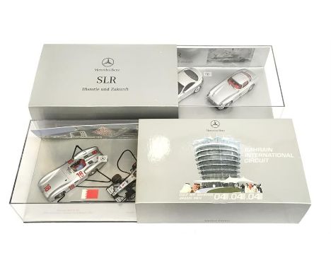 Two Minichamps Mercedes 1/43 scale sets: B6 6045916 Bahrain GP 2004 Mercedes Benz W196/ McLaren F1 (outer card sleeve water d